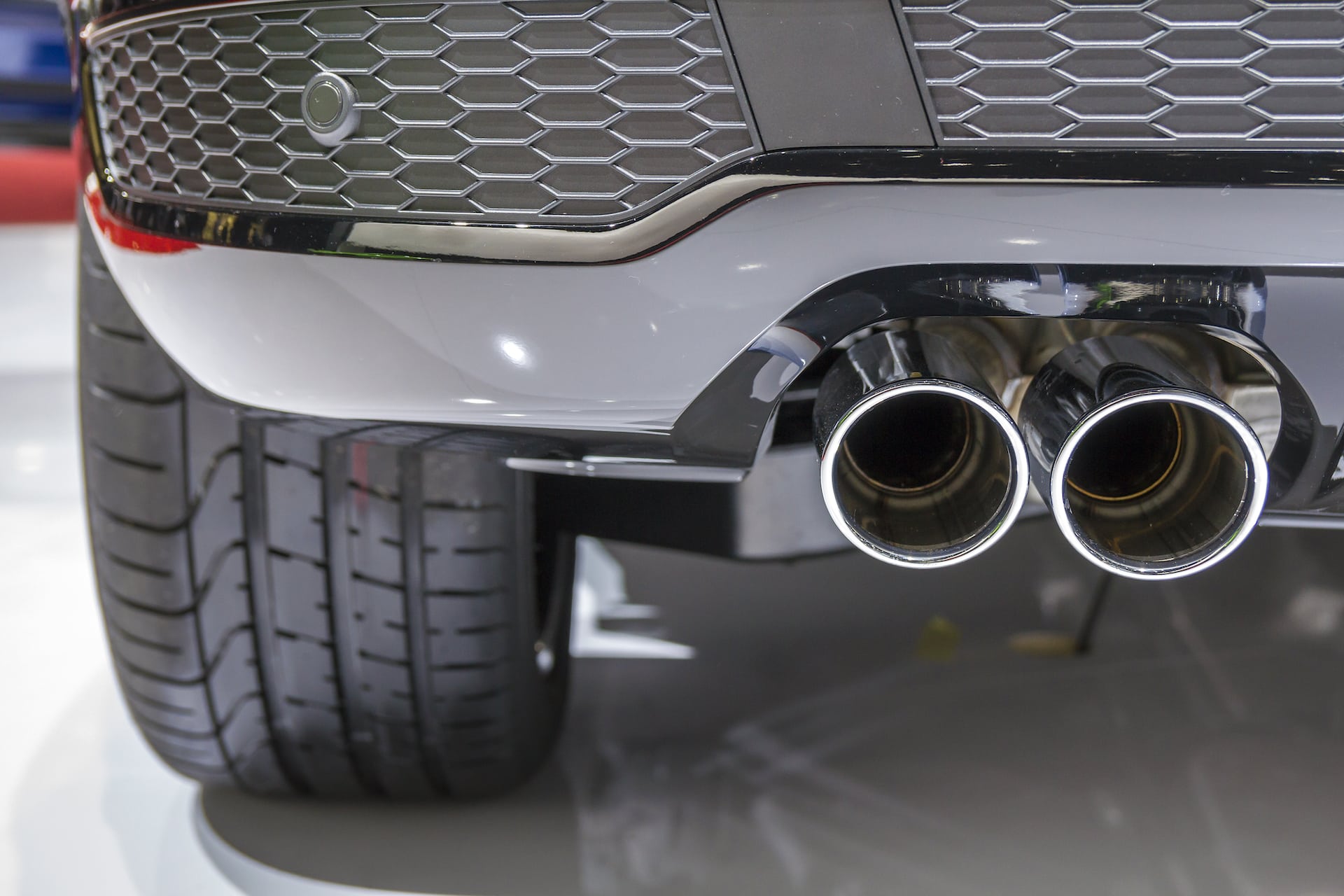 Understanding Grade 434 Stainless Steel Double chrome exhaust pipe of powerful sport car with grey plastic details Understanding Grade 434 Stainless Steel